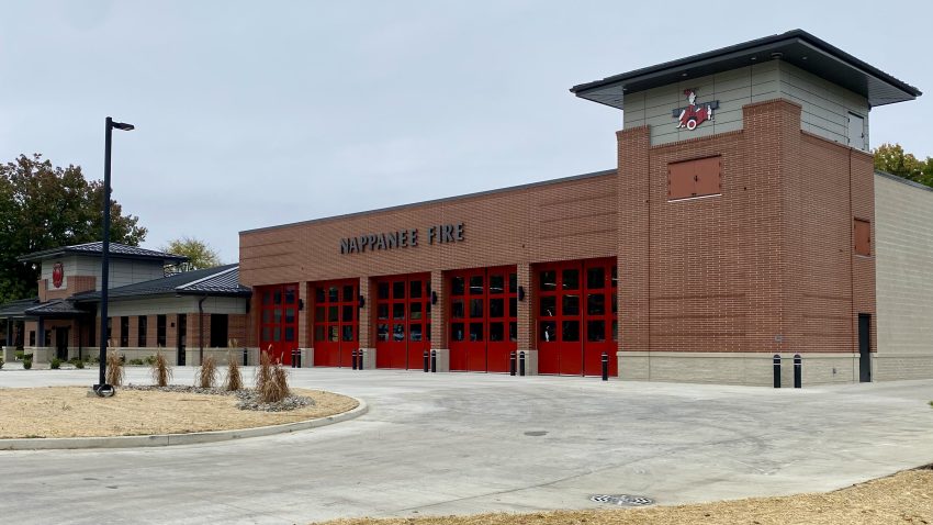 Fire station with a row of red commercial overhead doors by 4-T Door Systems in Syracuse, IN